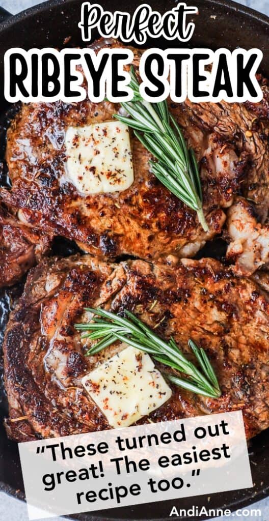 Close up of two ribeye steaks topped with butter and fresh rosemary