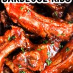 Close up of tender slow cooker barbecue ribs in a black slow cooker pot