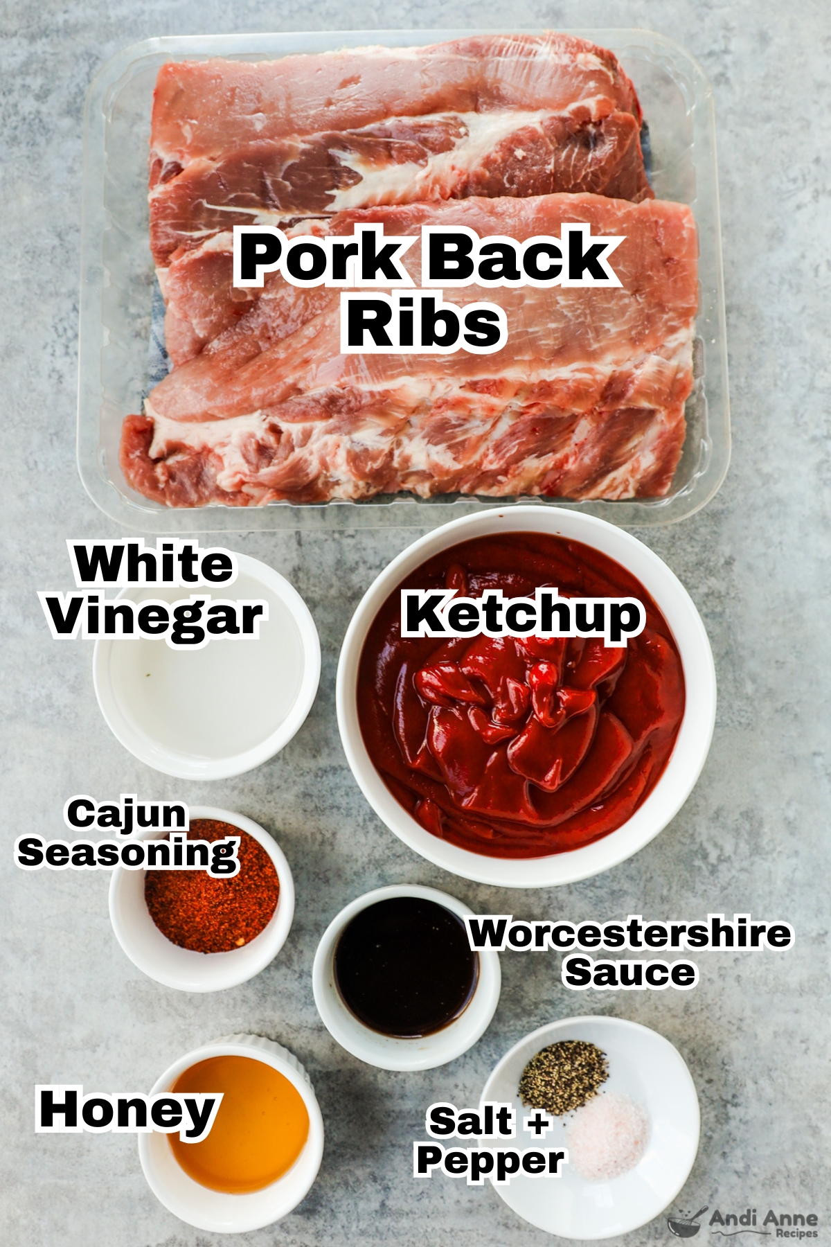 Recipe ingredients including raw pork ribs, bowls of vinegar, ketchup, cajun seasoning, worcestershire sauce, honey, salt and pepper