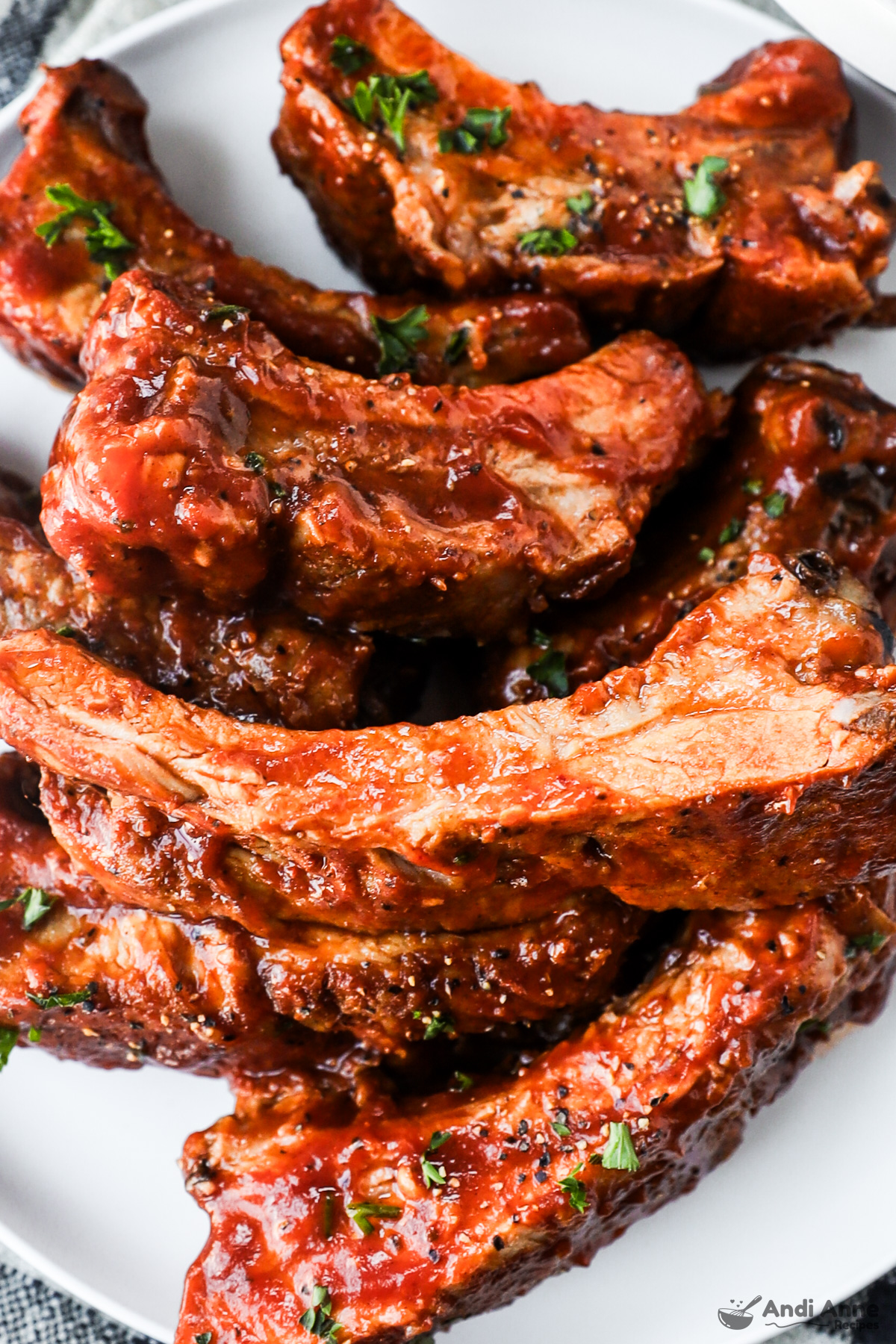 Close up of crockpot cooked barbecue ribs  on a plate