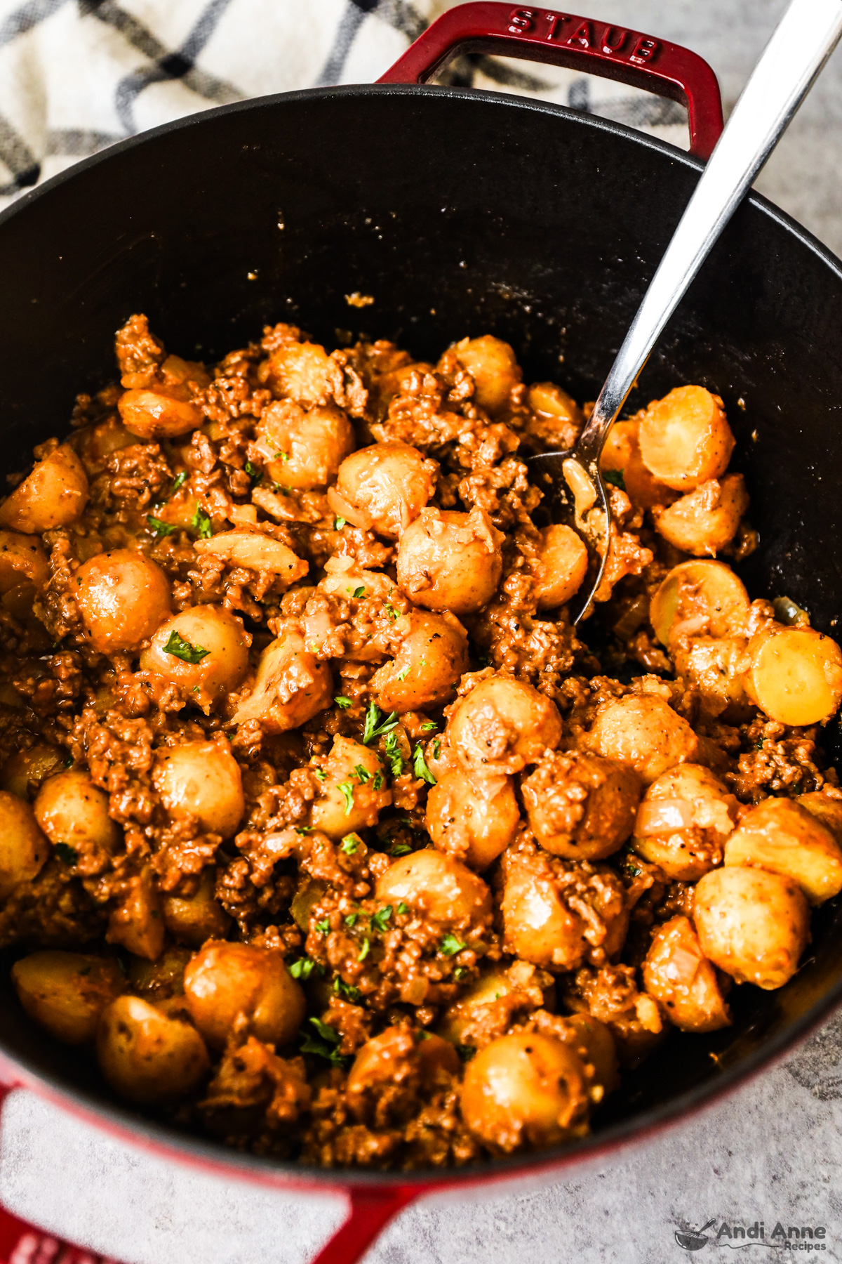 Close up of cheesy potatoes with ground beef all in one pot