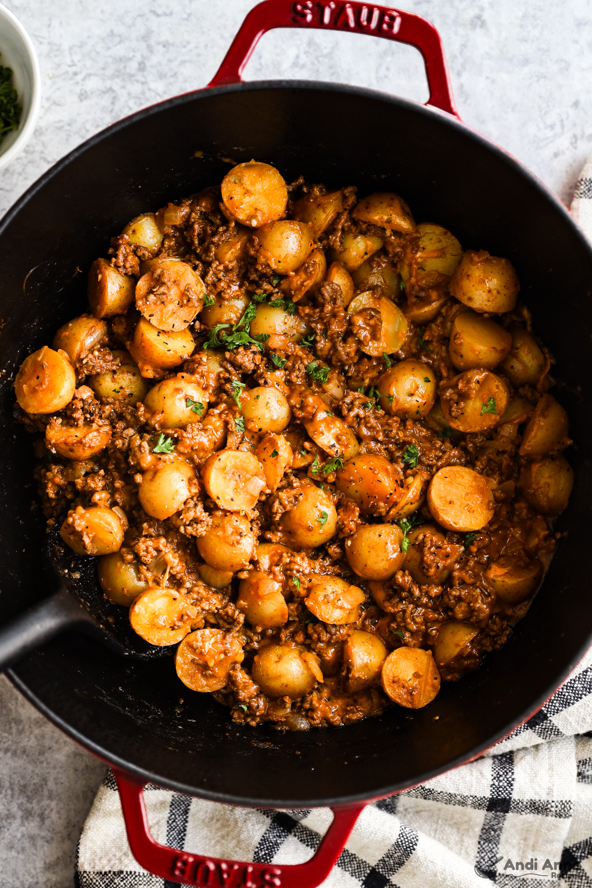 A pot of cheesy beef potatoes in a pot