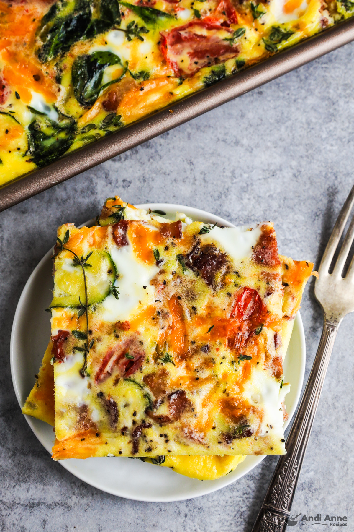 Slices of the sheet pan frittata on a plate with a fork