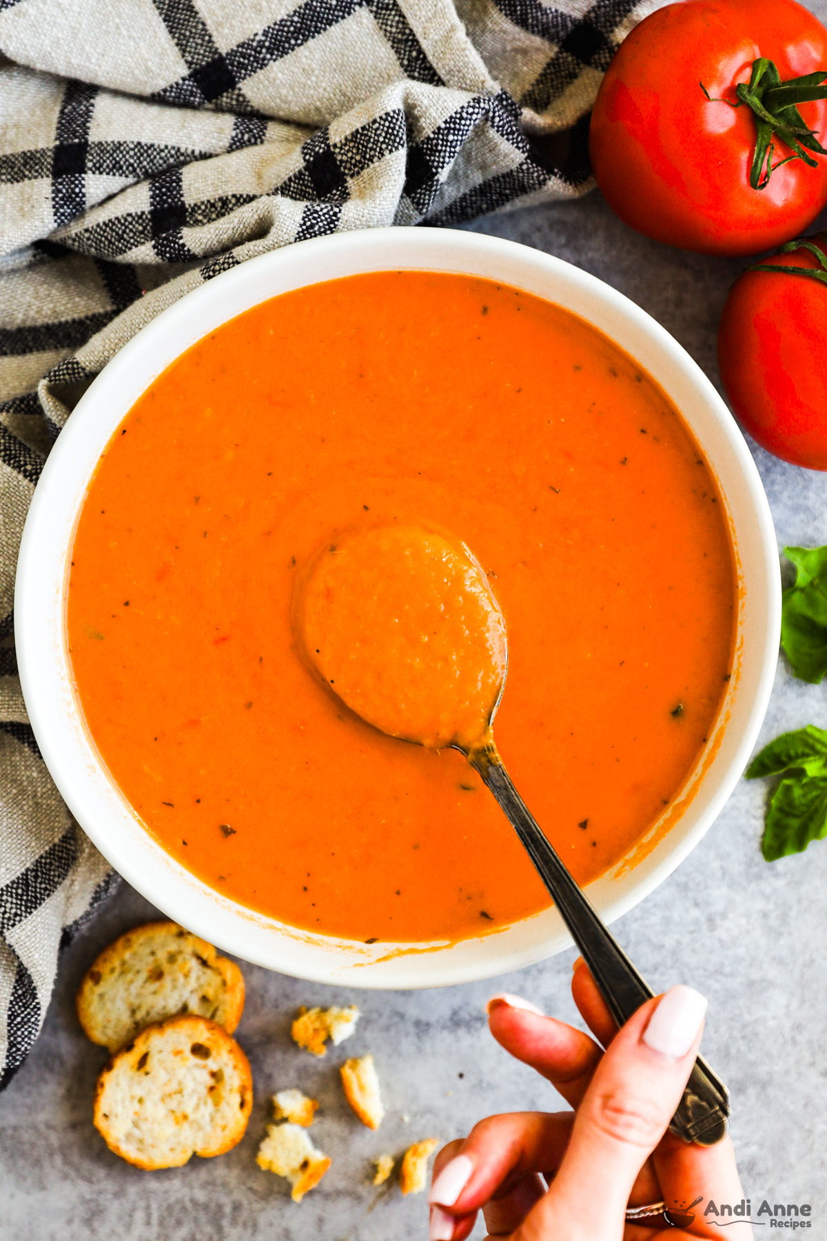 bowl of tomato soup with spoon