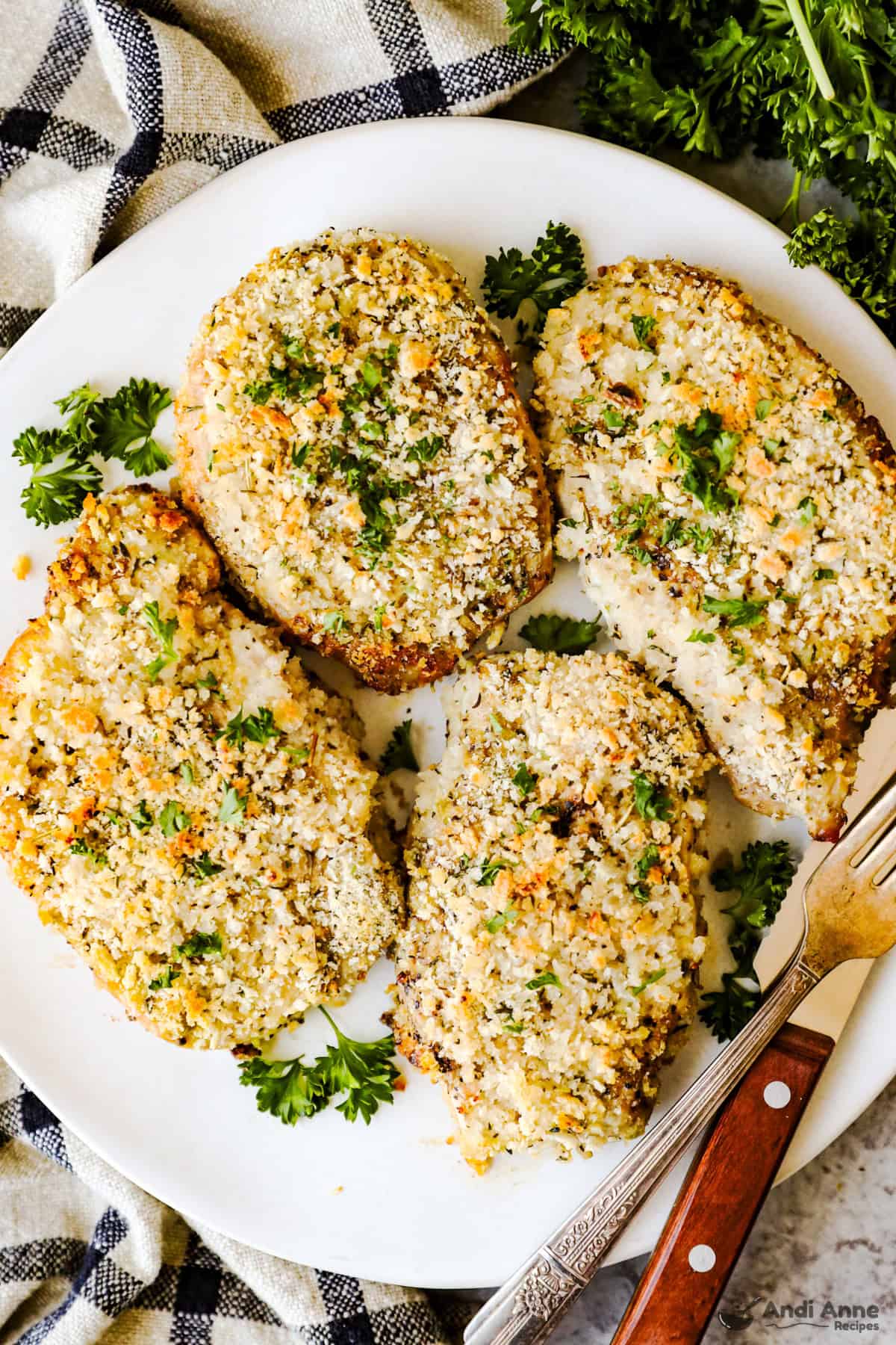 A plate of breaded pork chops.