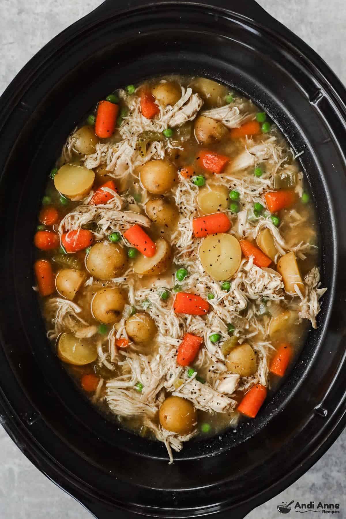 Closeup overhead view of cooked stew in slow cooker. 