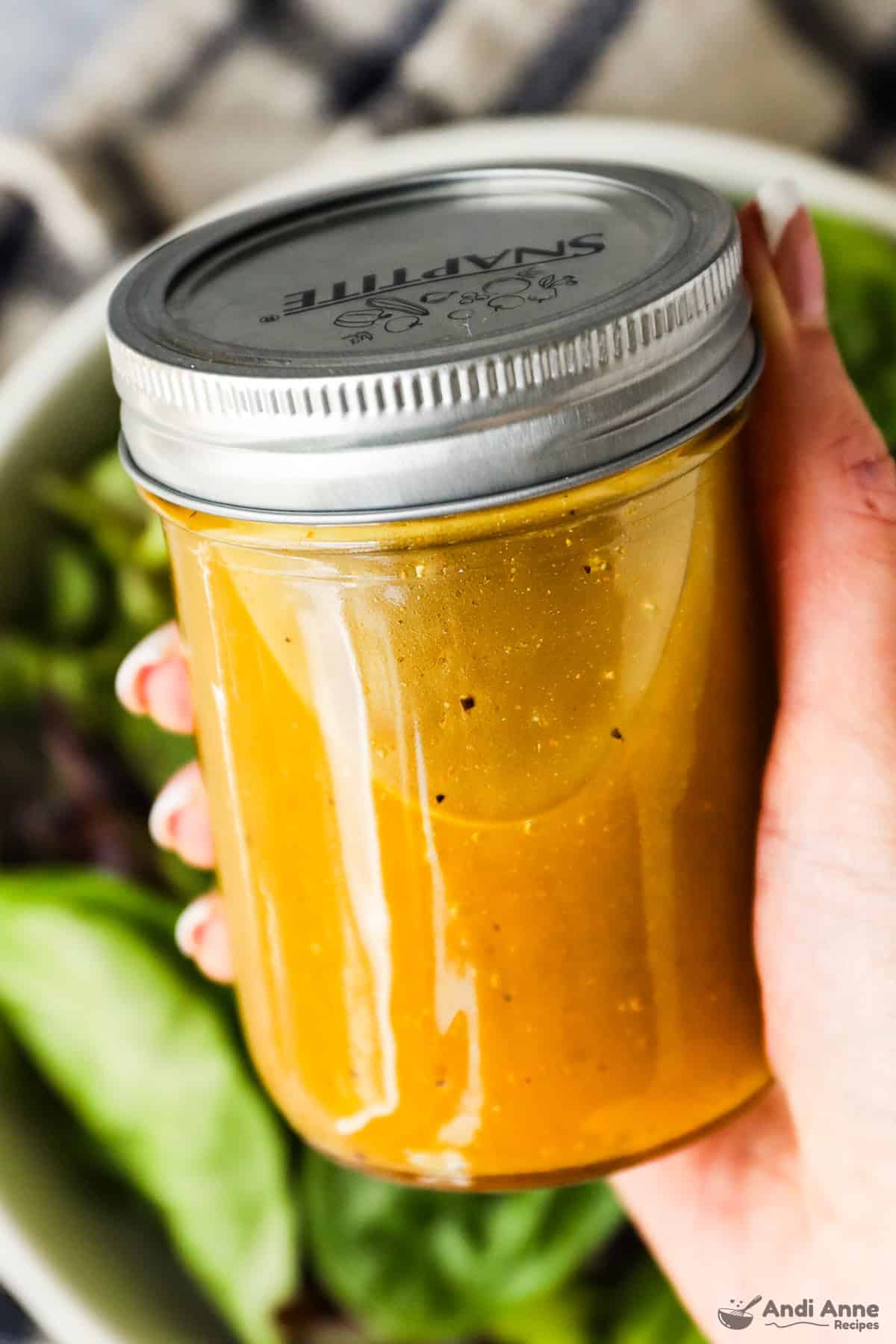 Classic vinaigrette dressing in a mason jar with a lid.