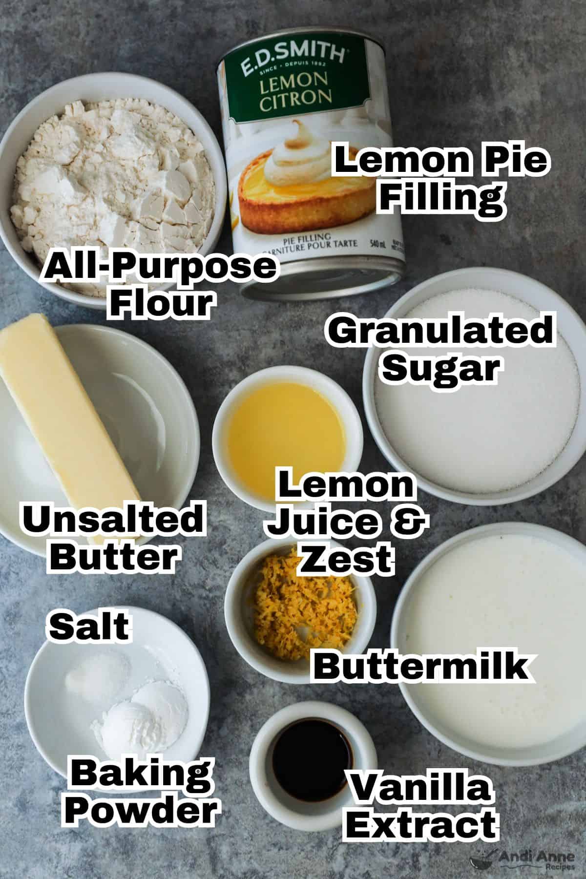 The ingredients needed to make magic lemon cobbler are in small white bowls.