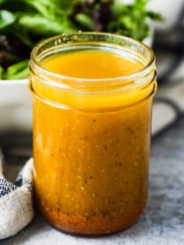 Classic vinaigrette salad dressing in a mason jar.