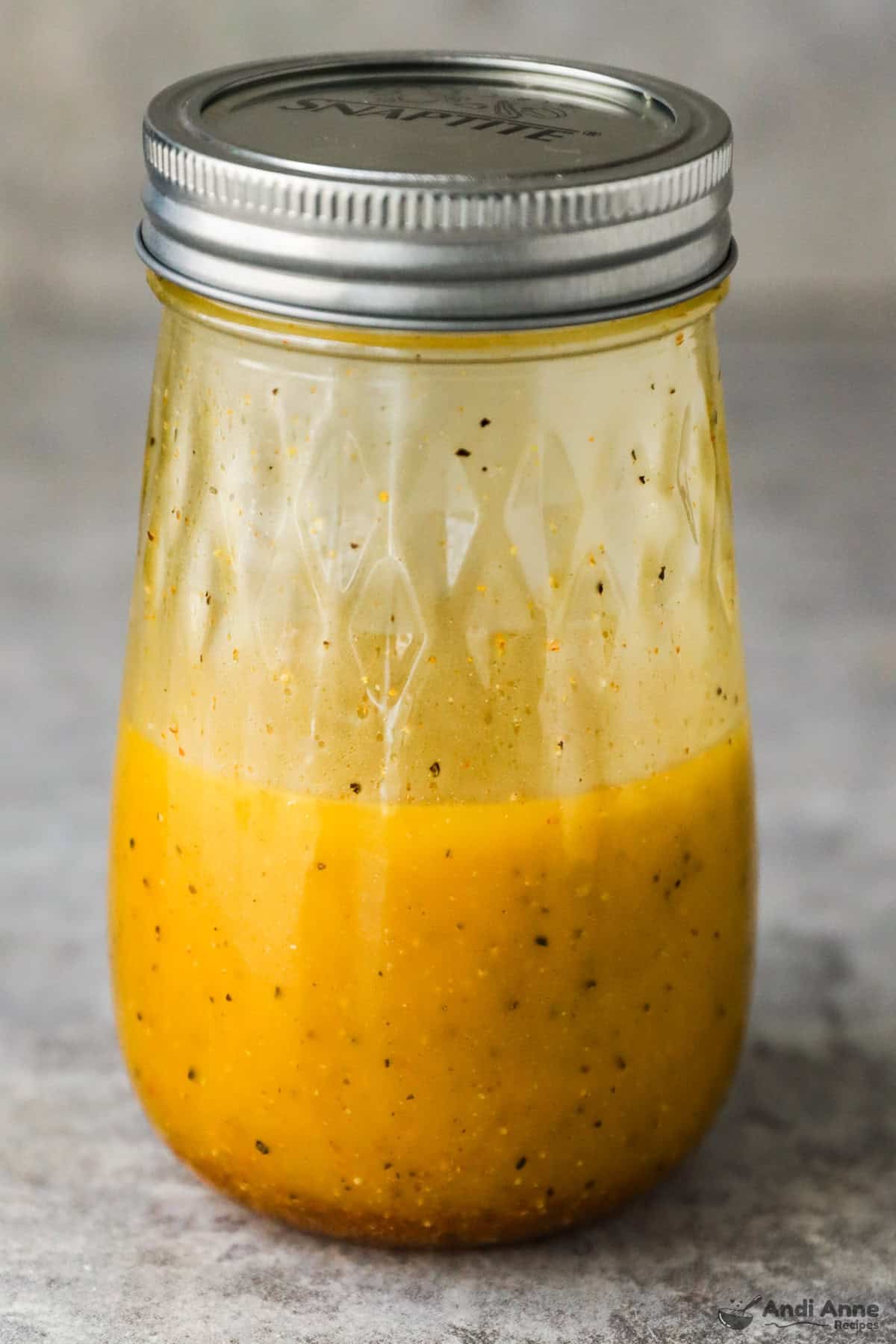 A jar of classic vinaigrette after shaking it.