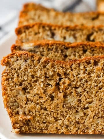 Slices of classic banana bread in a row.