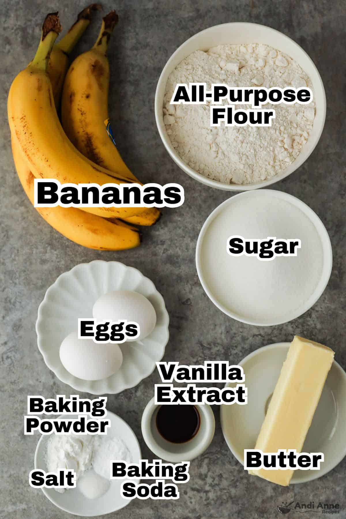 Ripe bananas and the other ingredients to make banana cake are in small individual bowls.