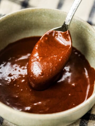 A spoonful of smooth chocolate frosting.