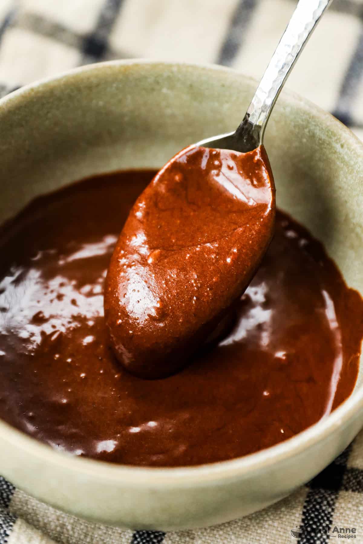 A spoonful of smooth chocolate frosting.