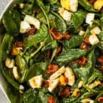 Spinach salad with bacon and chopped hard boiled egg.