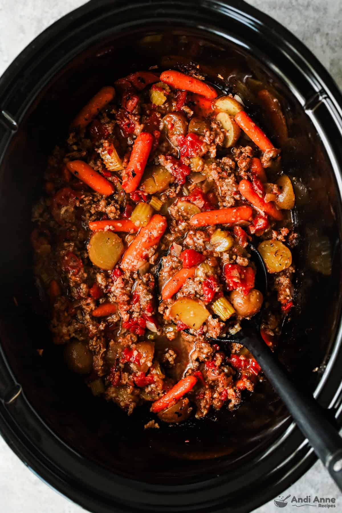 A crockpot filled with a ground beef stew.