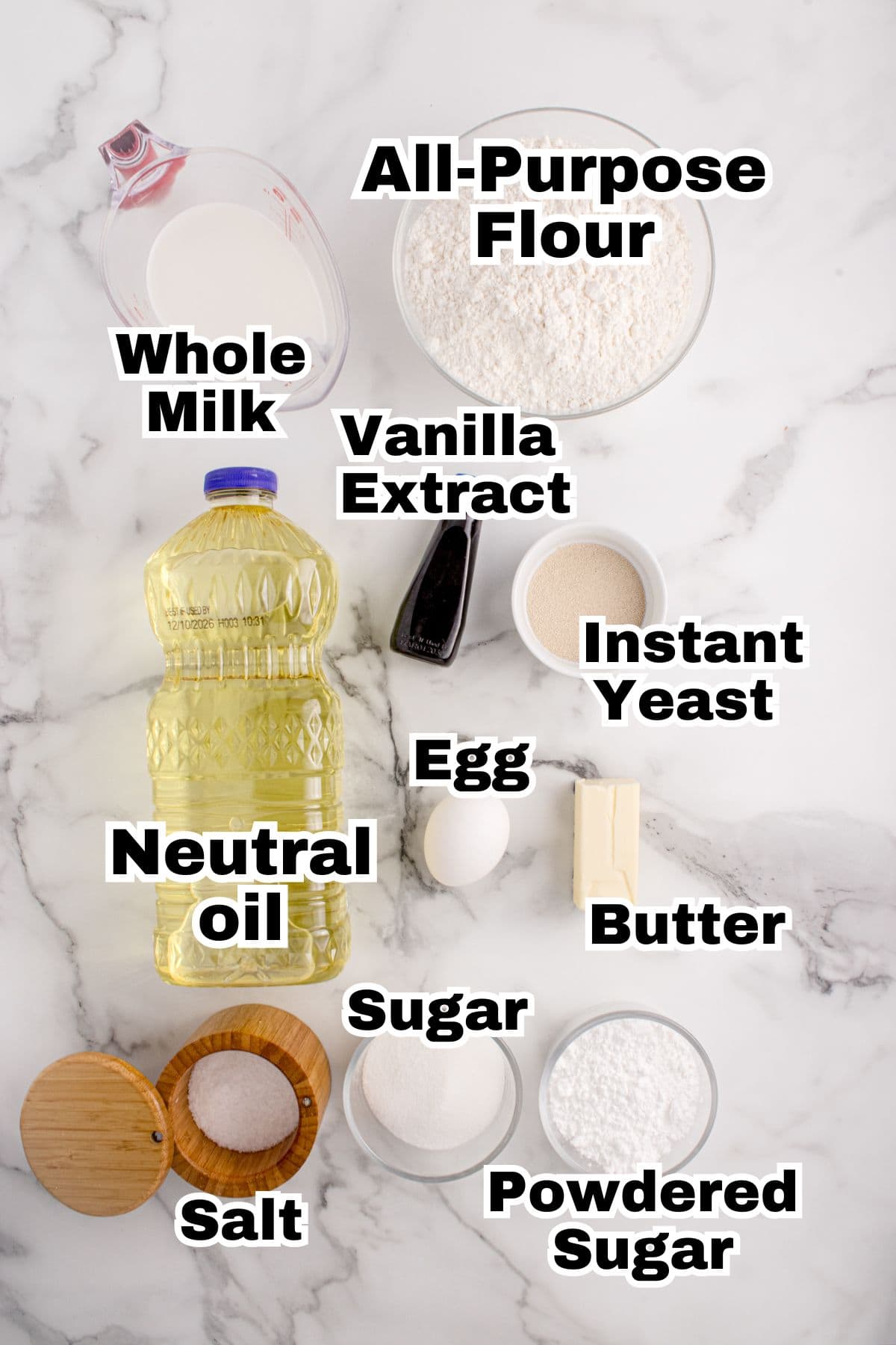 The ingredients to make beignets are in individual bowls.