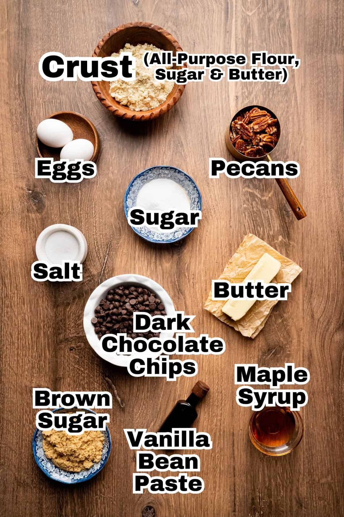 The ingredients to make salted chocolate pecan bars in small individual bowls.