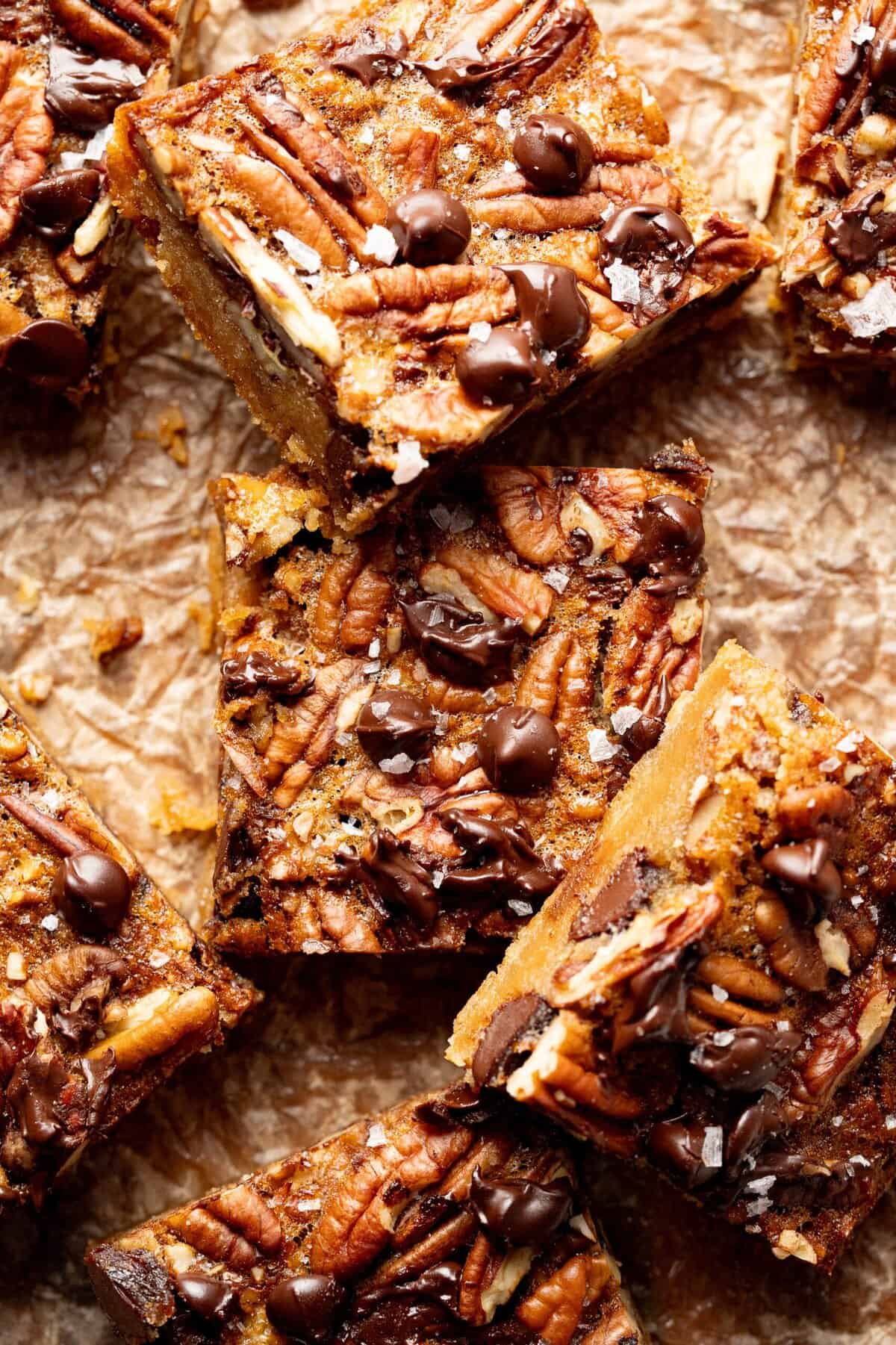 Salted chocolate pecan bars on a cutting board.
