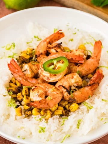Chili lime shrimp with fire-roasted corn served over rice.