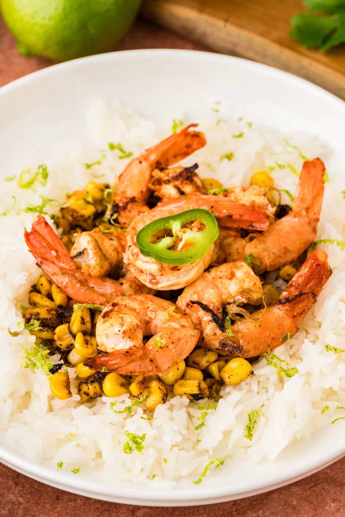Chili lime shrimp with fire-roasted corn served over rice.