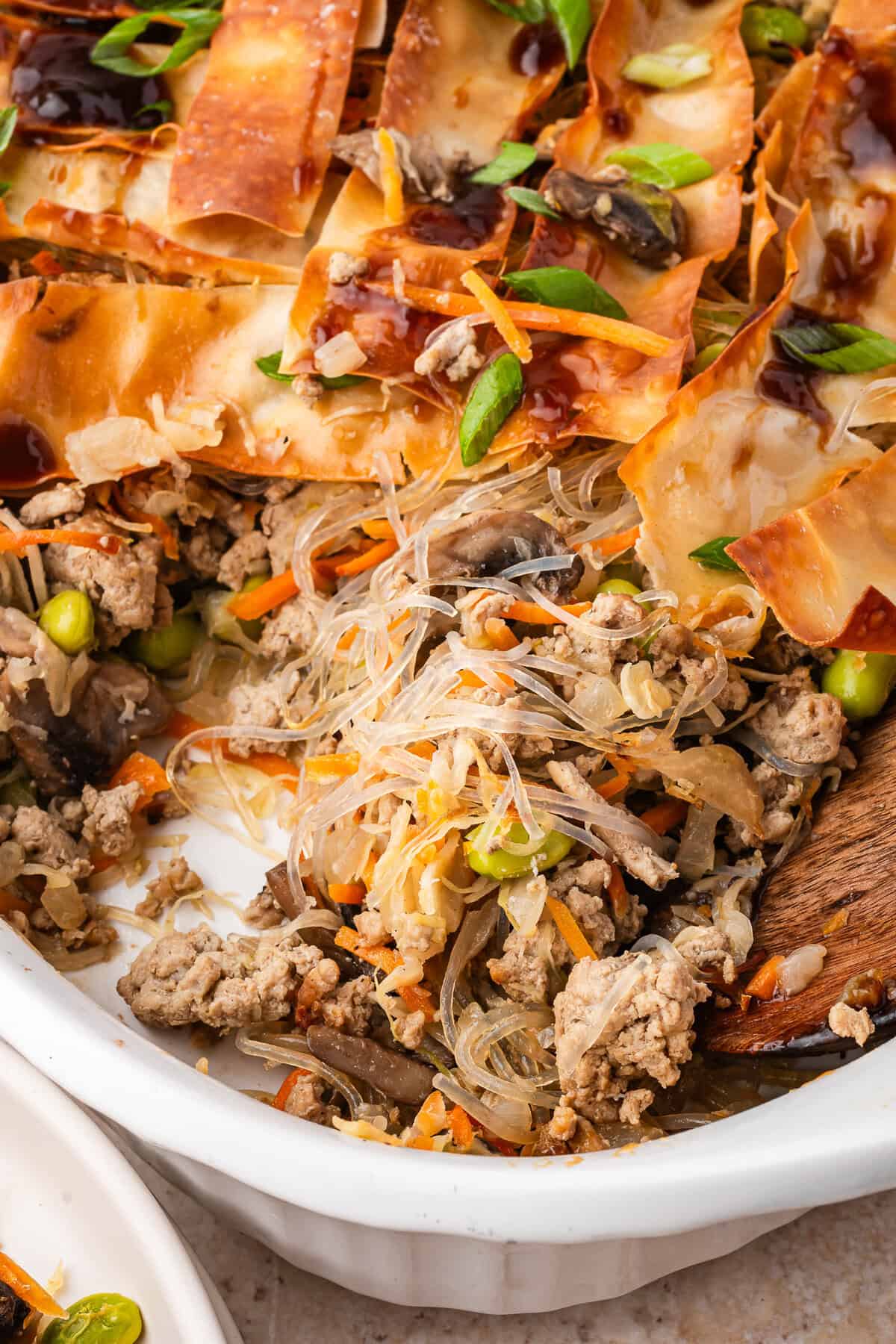 A serving of egg roll casserole on a spoon.