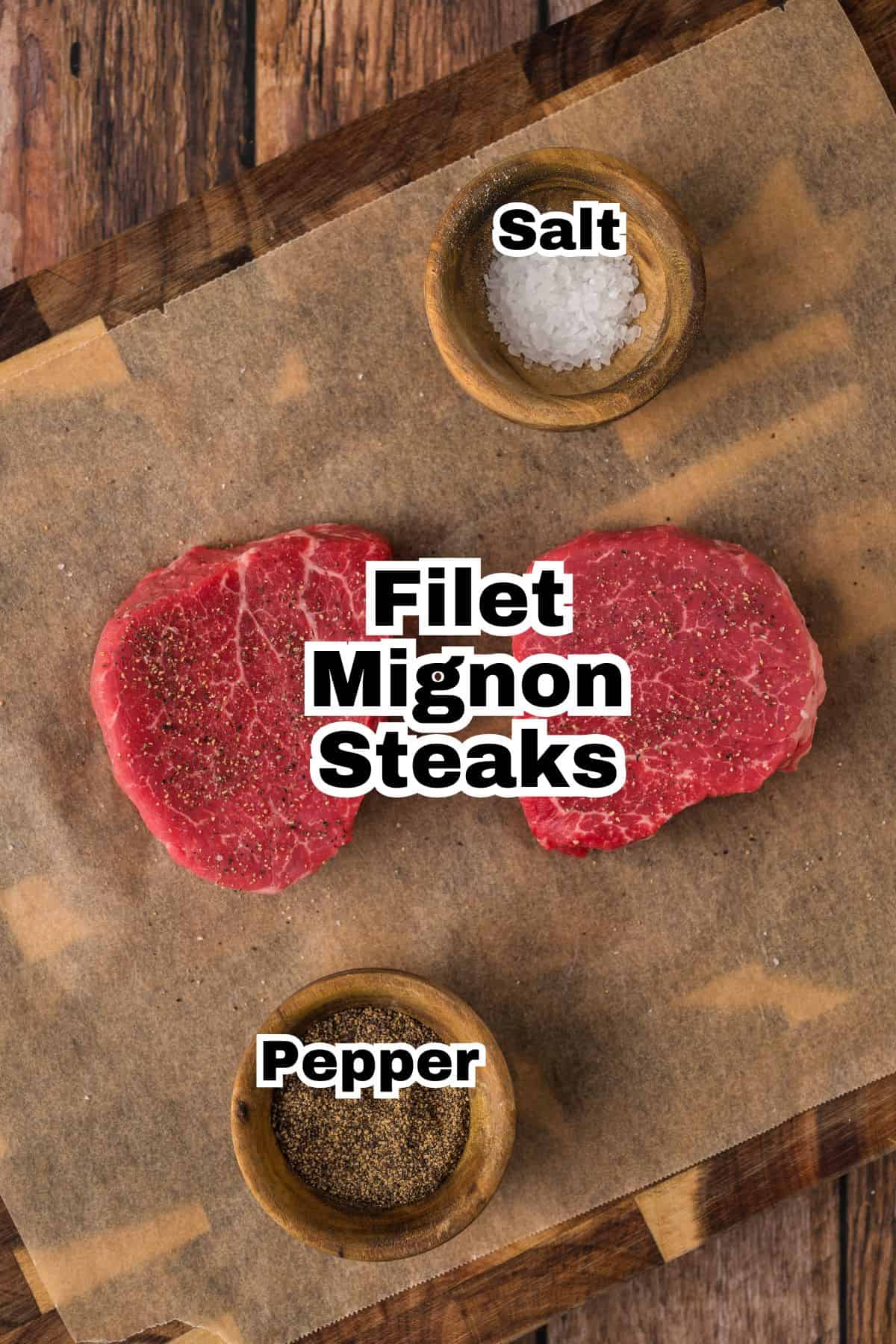 Filet mignon steaks, salt and pepper on a wooden cutting board.