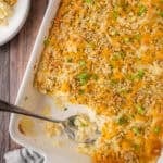 Cheesy mashed potato casserole in a large baking dish.