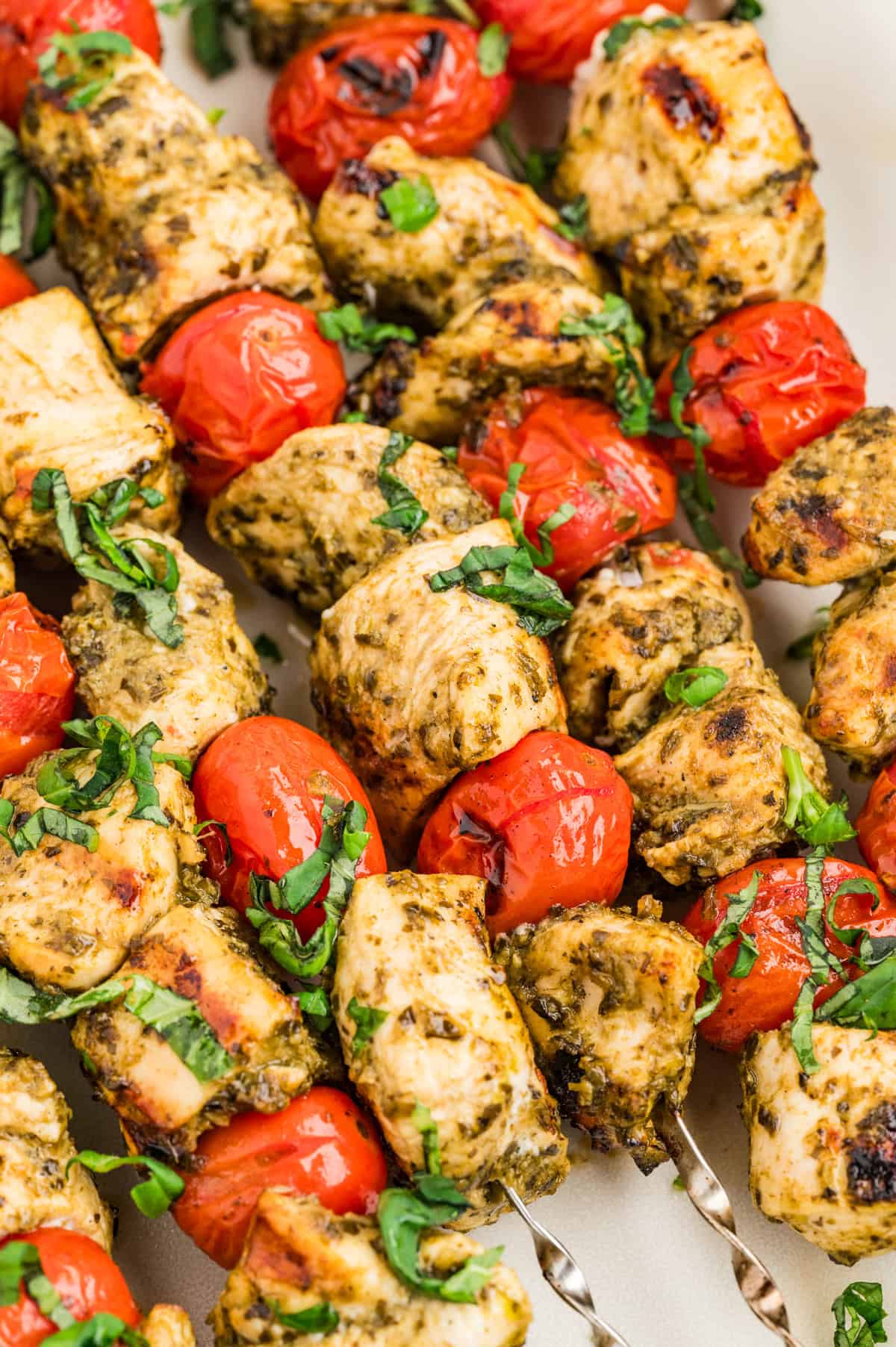 Skewers will grilled pesto chicken and tomatoes.