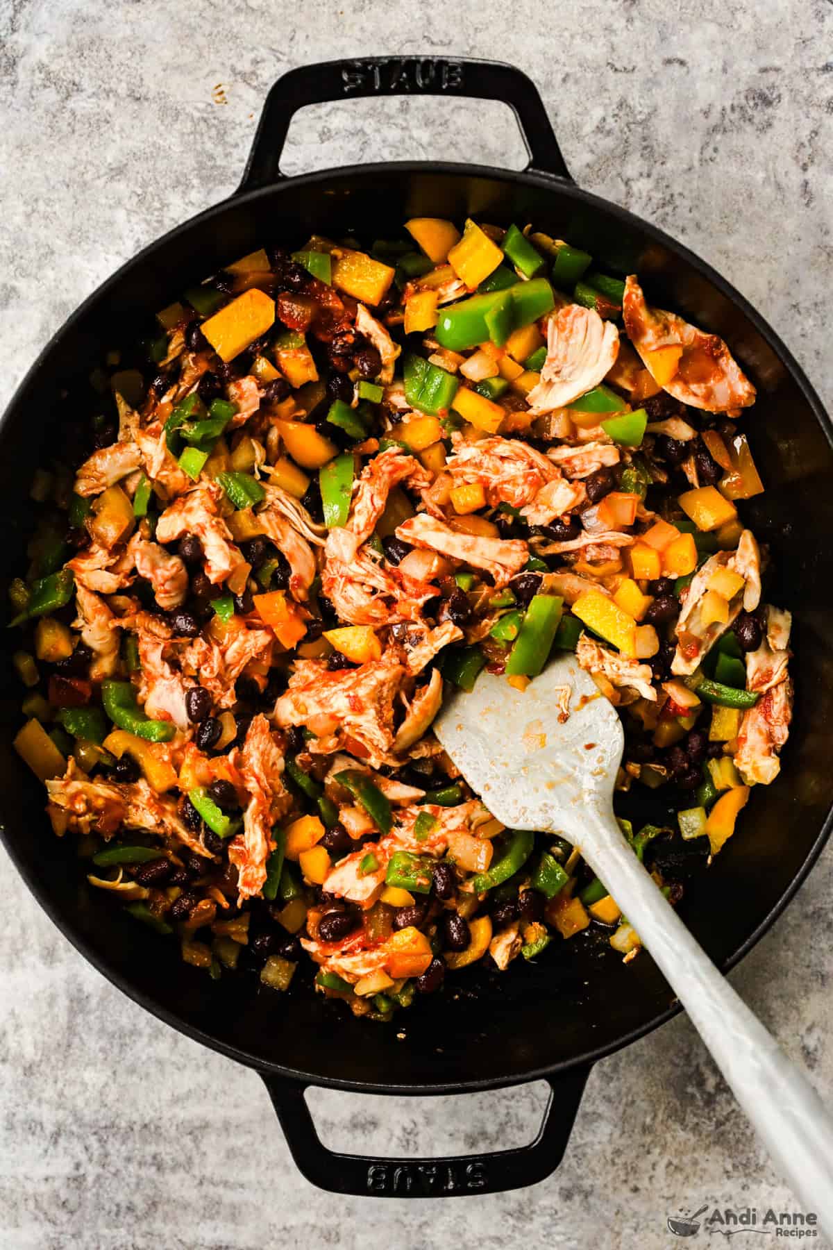 skillet of shredded chicken and chopped veggies
