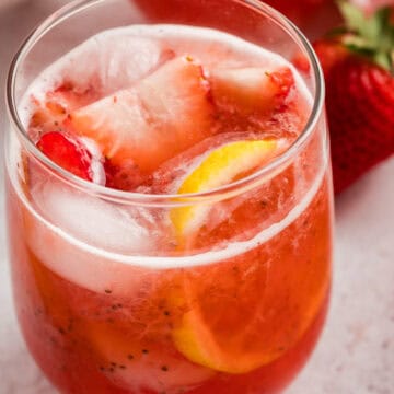 A glass of sparkling strawberry lemonade.
