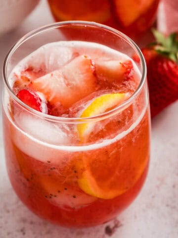 A glass of sparkling strawberry lemonade.