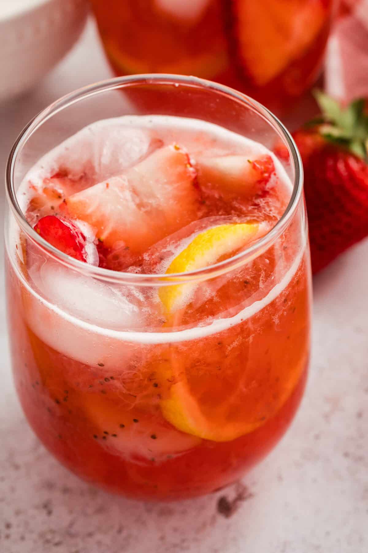 A glass of sparkling strawberry lemonade.