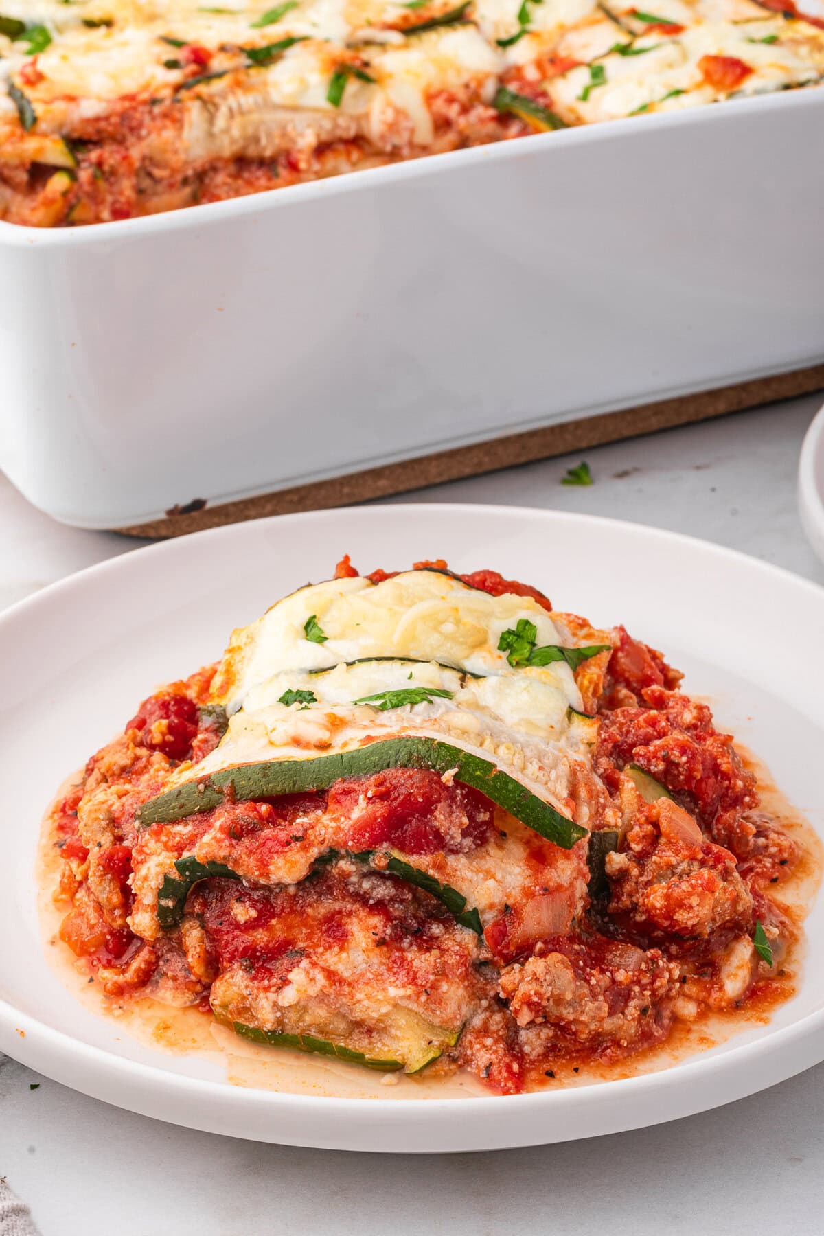 A portion of zucchini lasagna on a plate.