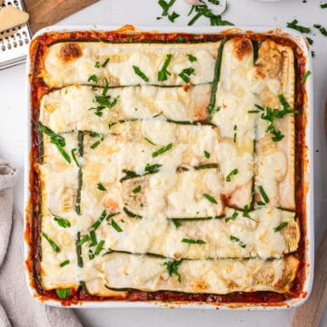 Zucchini lasagna in a 9x9 baking pan.