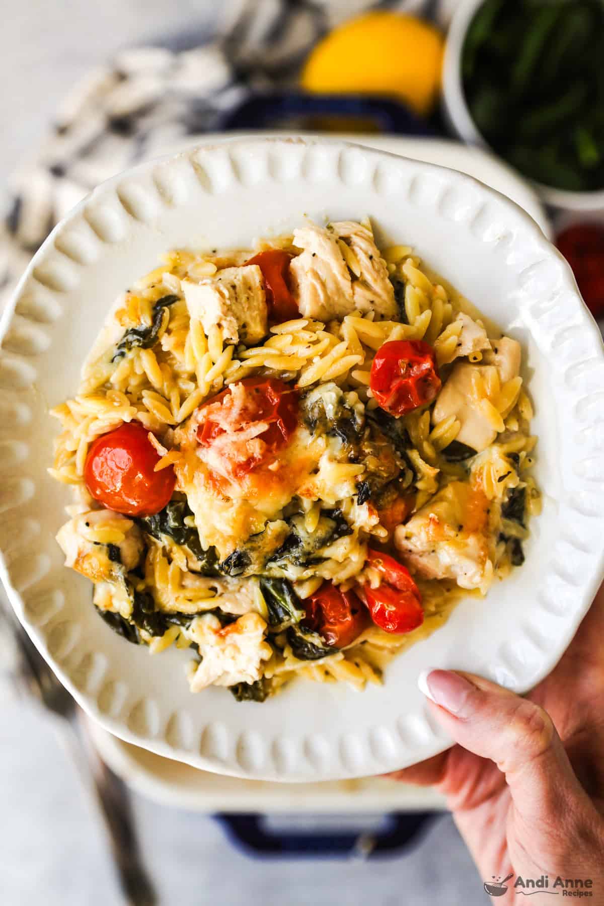Greek chicken and orzo casserole on a plate.