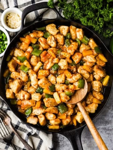 Honey garlic pineapple chicken in a skillet.