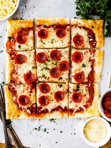 Pepperoni pizza with a puff pastry crust.
