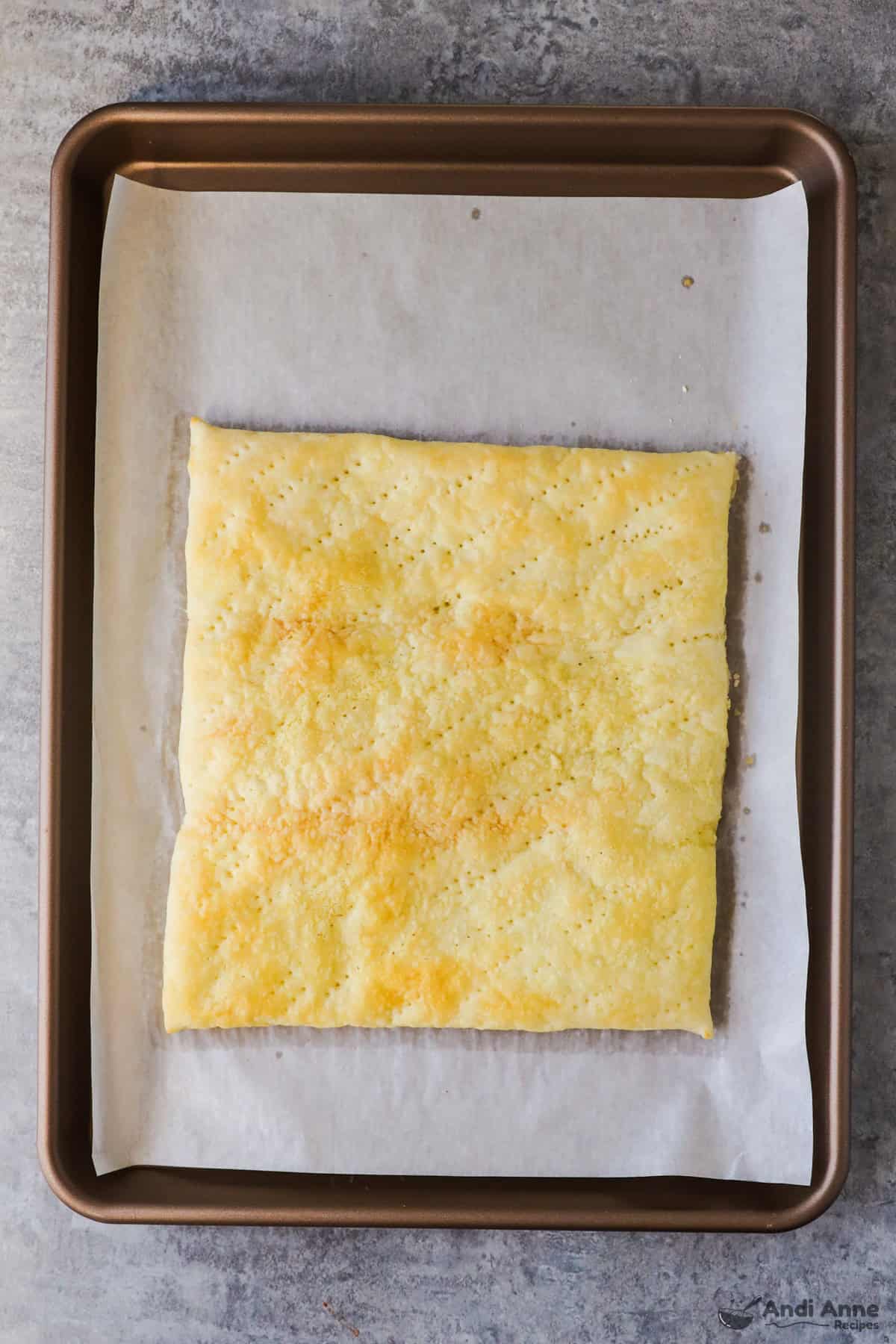 Puff pastry after docking and baking.