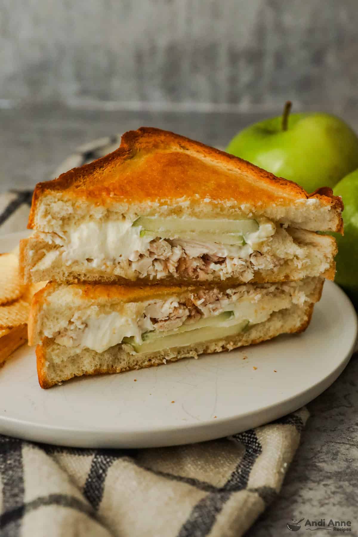 Toasted chicken and apple sandwiches with melted cream cheese.