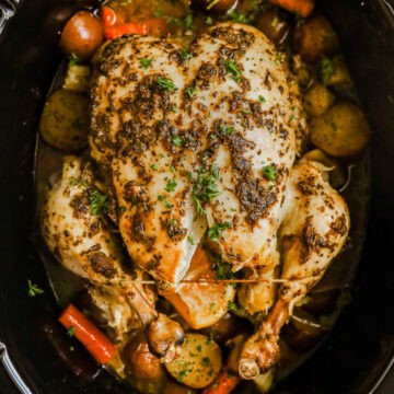 Roasted chicken and vegetables in a slow cooker.