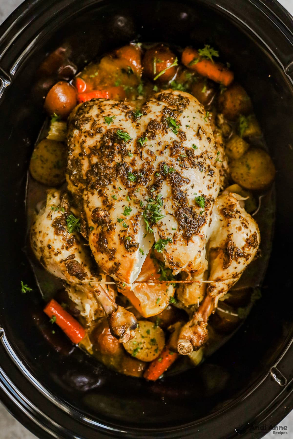 Roasted chicken and vegetables in a slow cooker.