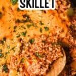 close up of unstuffed bell pepper skillet topped with melted cheddar cheese