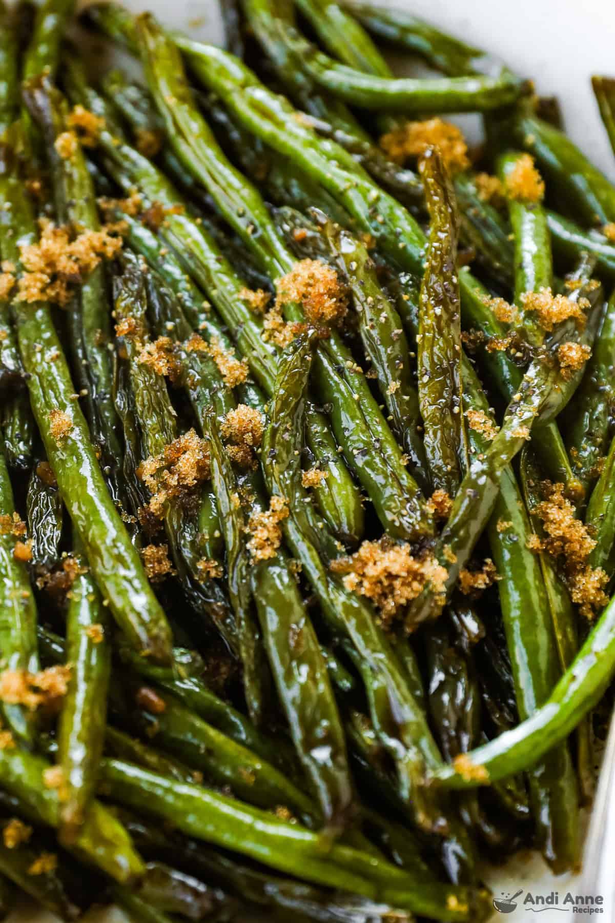 A close up of the brown sugar green beans in a serving dish.