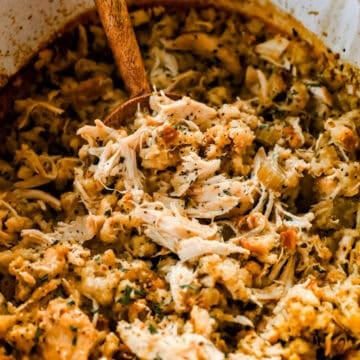 crockpot chicken and stuffing with wood spoon
