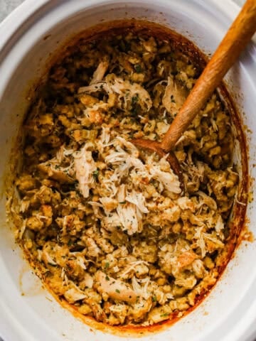crockpot chicken and stuffing with wood spoon