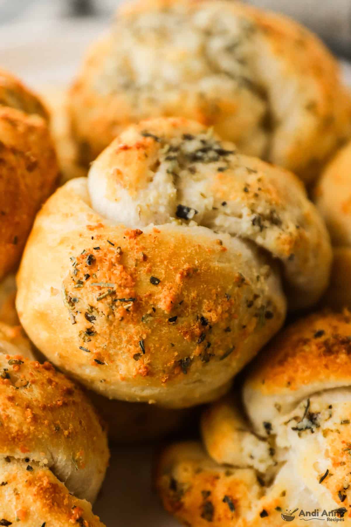 A close-up of garlic parmesan knots made from refrigerated biscuits.