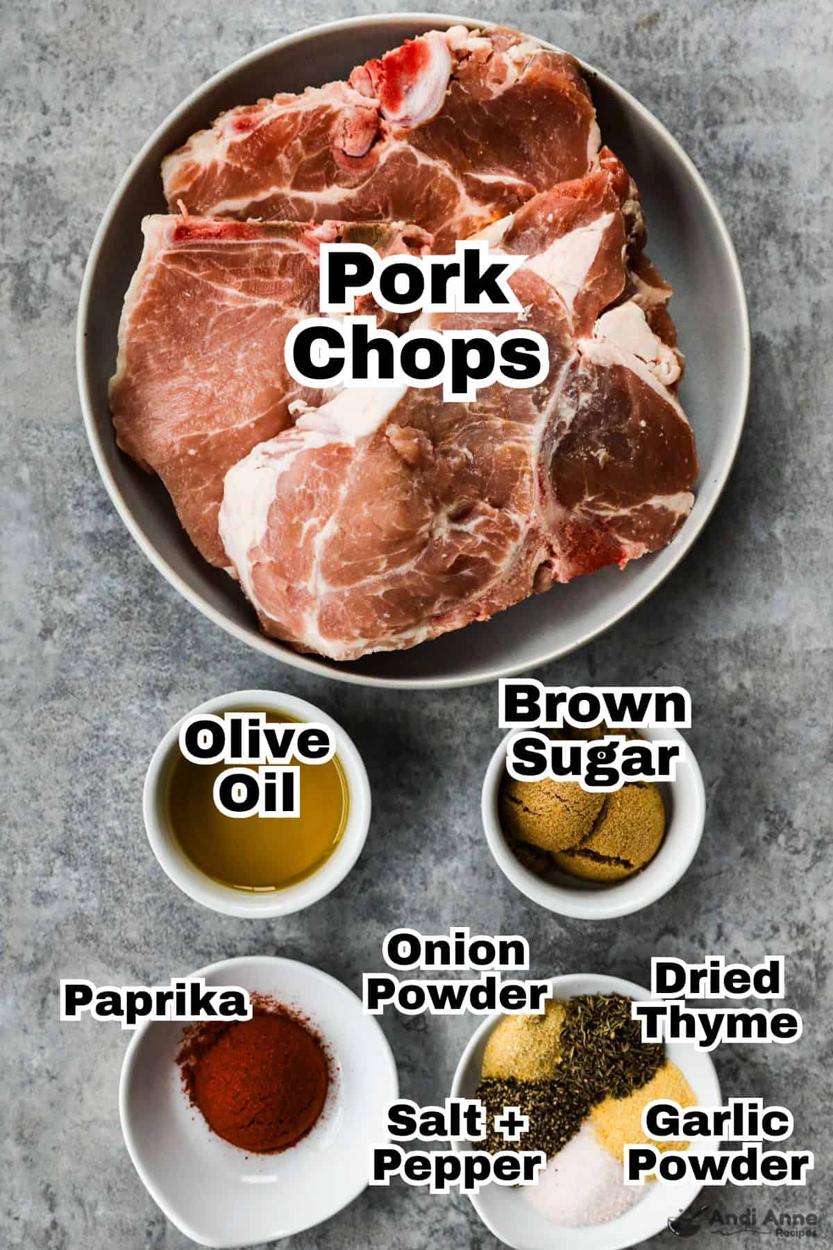 The ingredients to make air fryer pork chops are in small bowls.