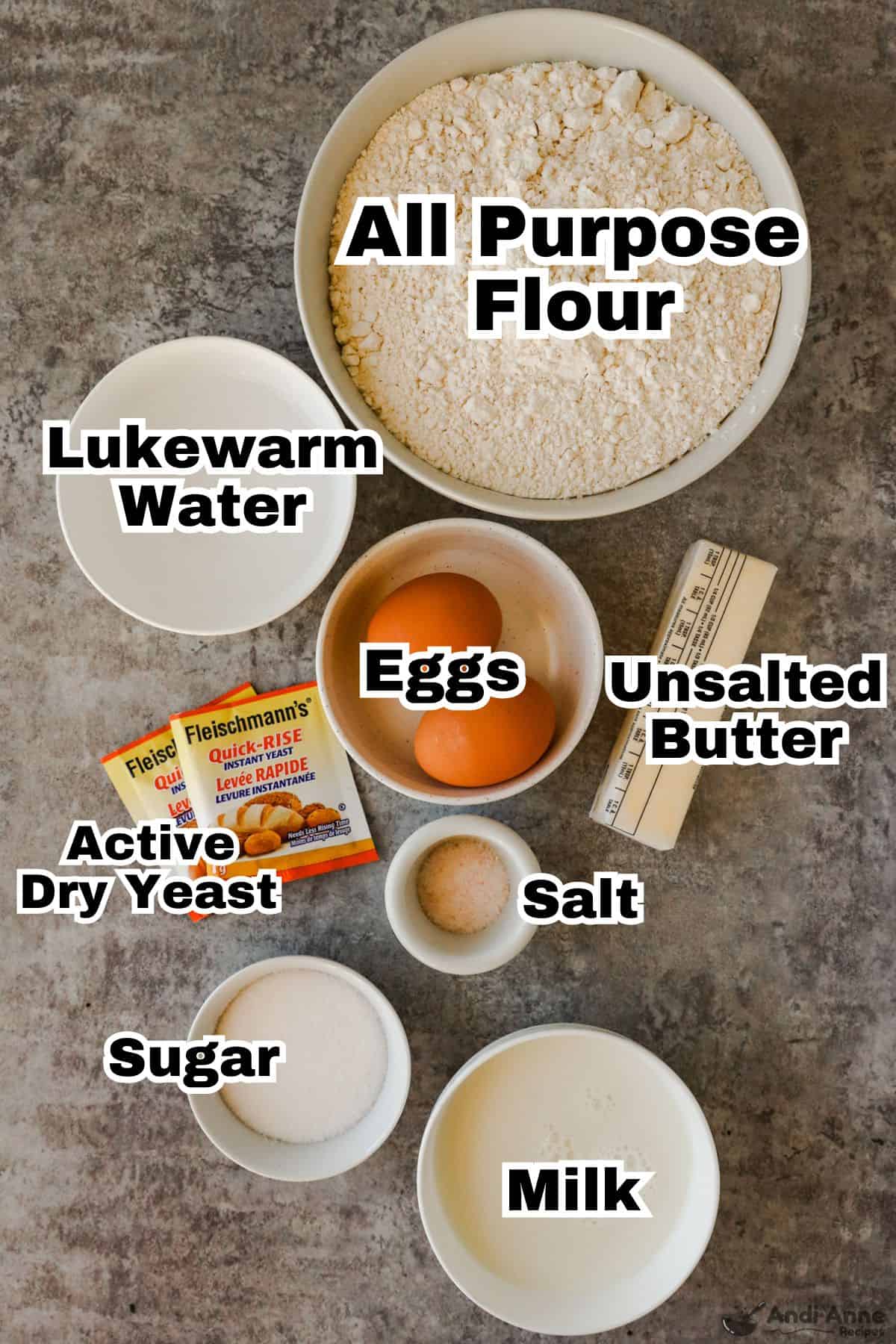 ingredients to make dinner rolls in bowls including flour, eggs, sugar, milk butter and yeast