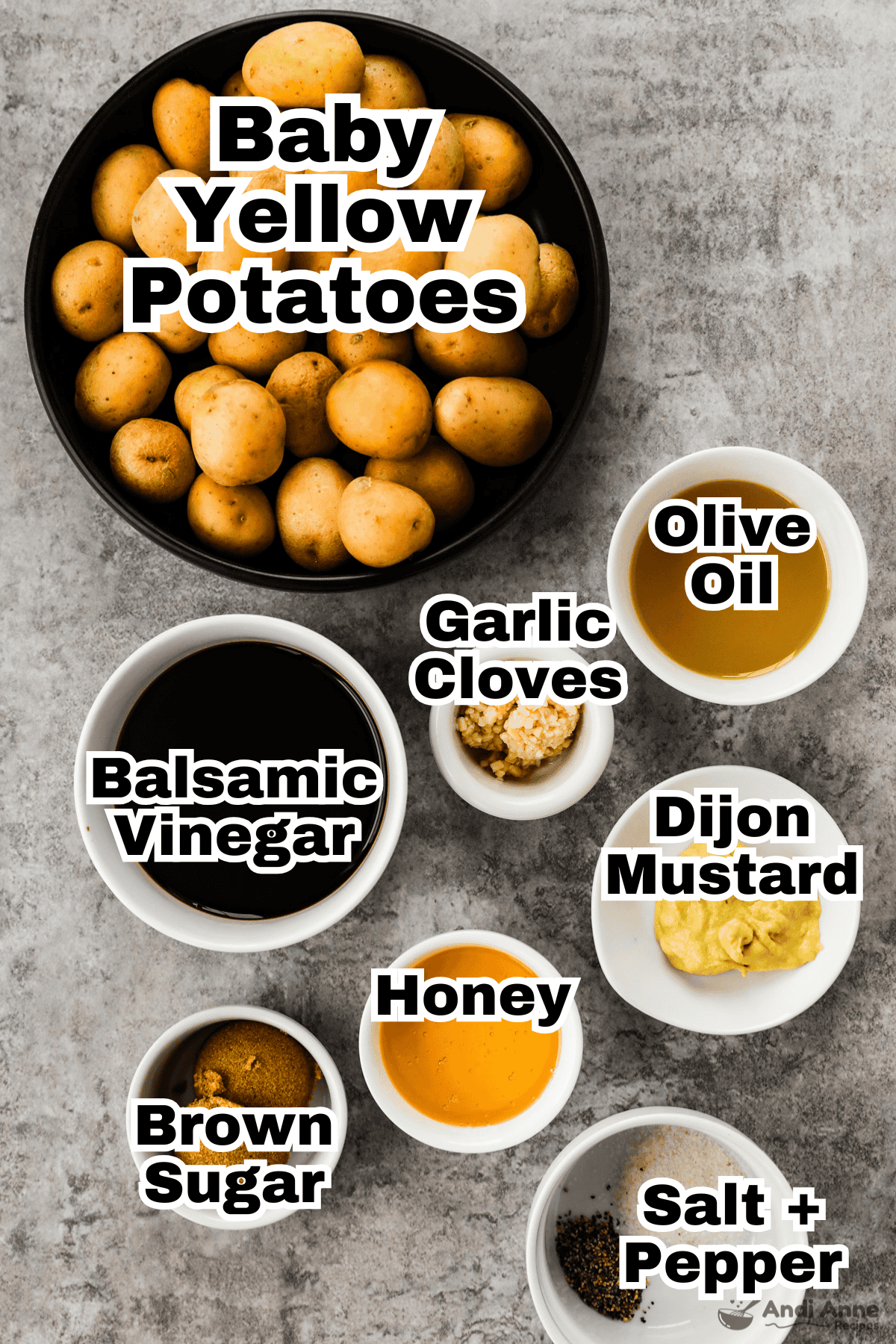 The ingredients to make honey balsamic roasted baby potatoes are all in individual bowls.